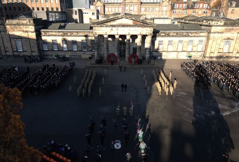 Armistice Parade 2023. In front of main school entrance in courtyard. With all of school attendants participating and showing respects.