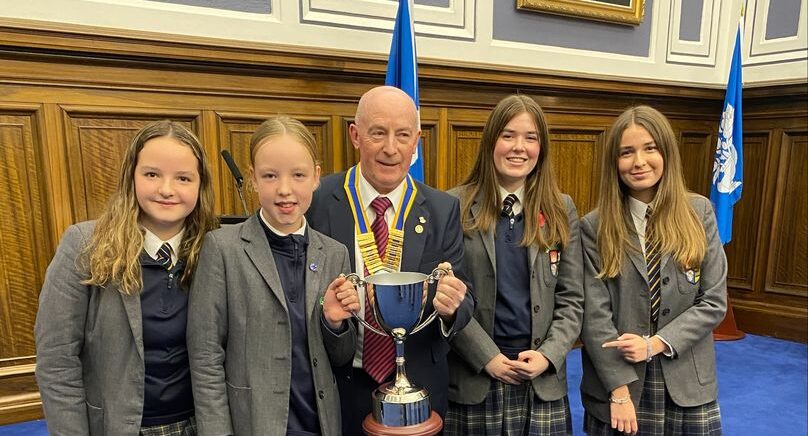 Team HSD Awarded Cyclathon Fundraising Trophy. Pupils being awarded a trophy posing for photo.