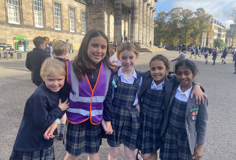 Thank You To Our Playground Pals ! featured. Pupils on school playground posing for photo looking joyful.