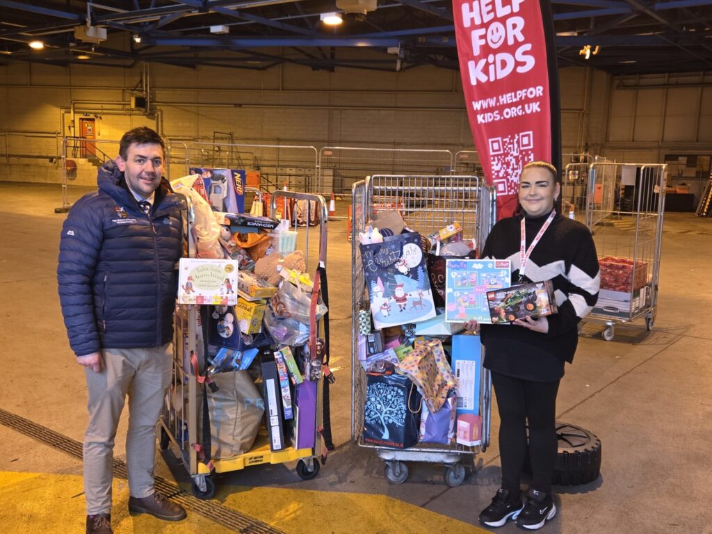 Anthony Kent hands over the Help for Kids Christmas donation